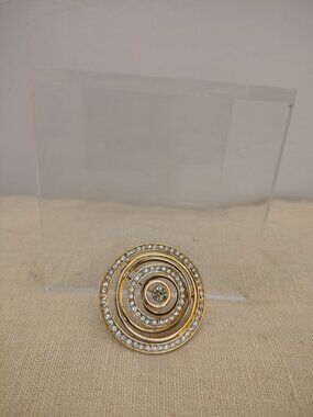 Polished Gold Tone Swirl Brooch with Rhinestones and large center Rhinestone
